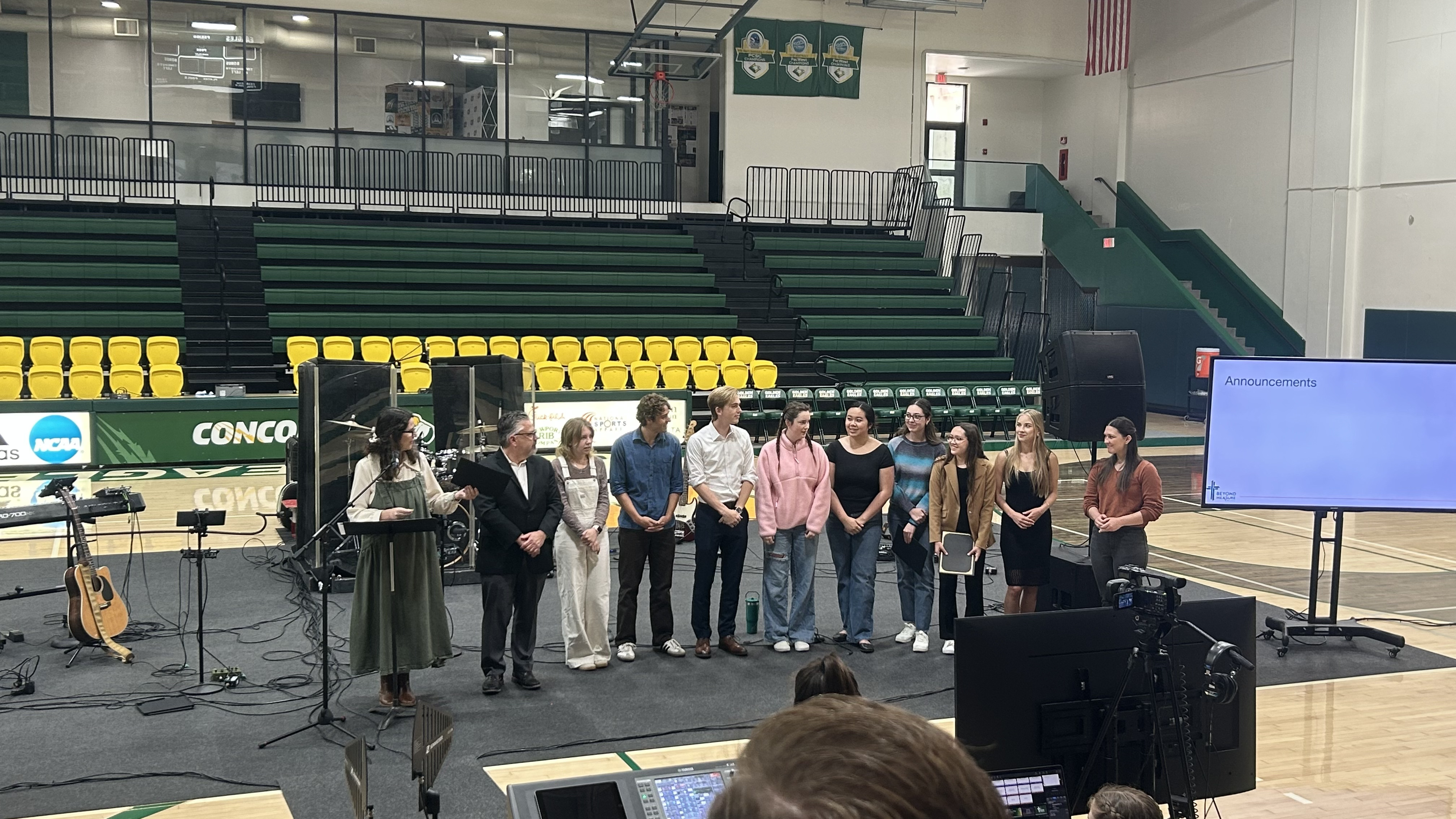 Tier 1 Finalists line up with President Dr. Michael Thomas to receive their awards during Friday chapel